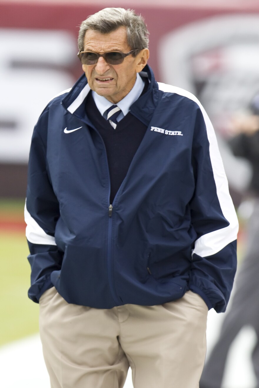 Joe Paterno walks the sidelines during warm-ups before a game between his Penn State Nittany Lions and the Temple Owls in Philadelphia last September. Paterno, who died in January, was fired on Nov. 9, four days after Jerry Sandusky was initially arrested on charges of sexually abusing 10 boys.