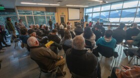 The meeting was standing-room only. A few dozen chairs filled quickly and fishers continued to line the walls of the Koniag Building on Near Island, September 19, 2023. (Brian Venua/KMXT)