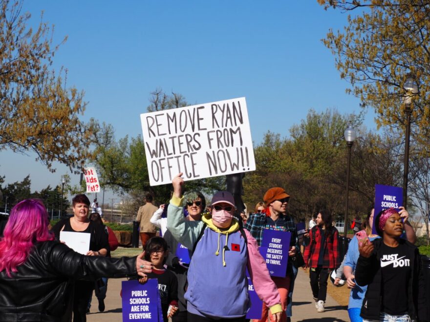 Oklahomans advocating for LBGTQ+ rights and safer public schools march from the state Capitol to the State Department of Education meeting on Thursday.