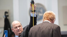 Defense attorney Jim Griffin measures Alex Murdaugh during a break in his double murder trial at the Colleton County Courthouse on Thursday, Feb. 16, 2023, in Walterboro, S.C. The 54-year-old attorney is standing trial on two counts of murder in the shootings of his wife and son at their Colleton County home and hunting lodge on June 7, 2021. (Joshua Boucher/The State via AP, Pool)