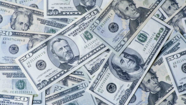 A picture of American currency spread around.