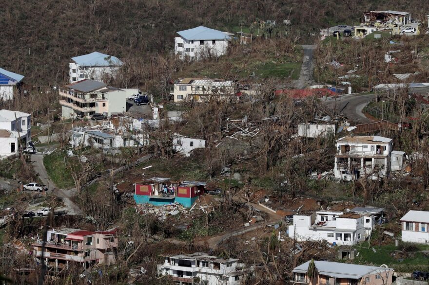 Houses in a variety of conditions — some with and without roofs — dot the hillsides more than a week after Hurricane Irma made landfall on Sept. 17, 2017, in Charlotte Amalie, St Thomas, U.S. Virgin Islands. (Chip Somodevilla/Getty Images,)