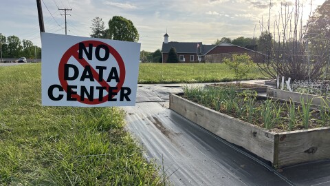 No data center sign stands in a Rural Hall field