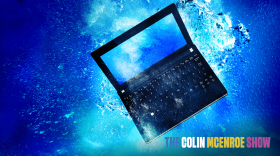 Computer netbook sinking underwater.
