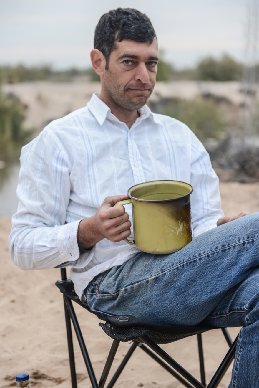 Rowan Jacobsen, shown here at the end of his paddle-boarding trip down the Colorado River delta, writes about food and the environment. His books include<em> A Geography of Oysters, Fruitless Fall</em> and <em>Shadows on the Gulf.</em>