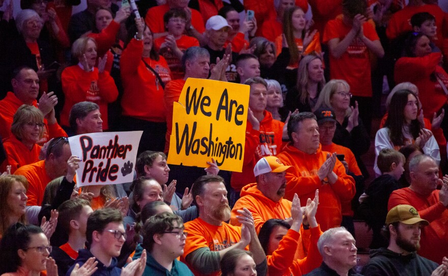 Girls high school basketball players inside an arena