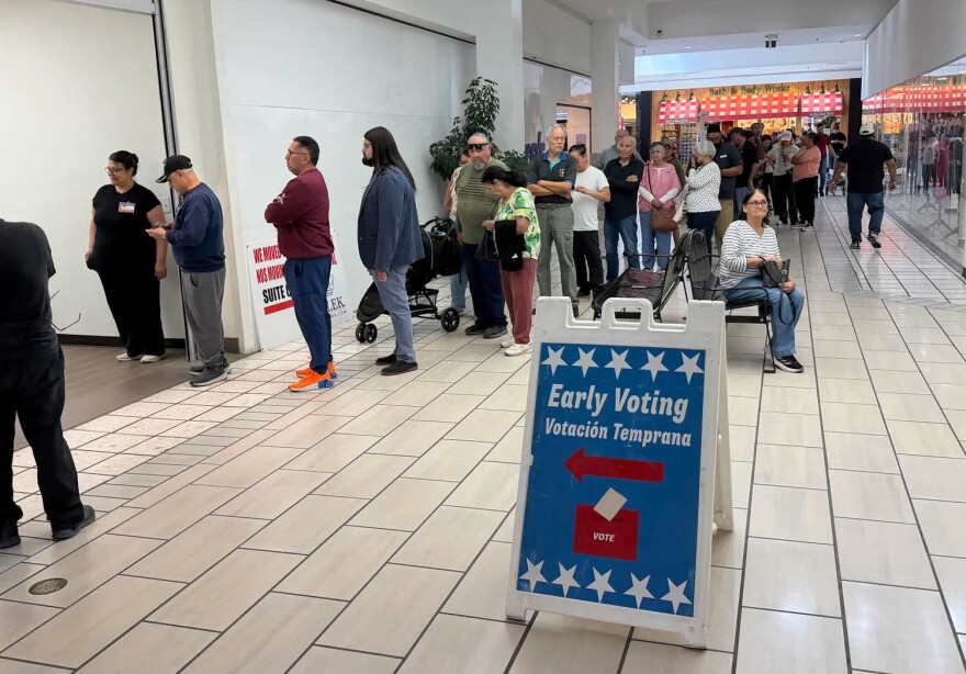 More than 100 people lined up during lunch to cast early votes at El Paso's Bassett Center on Monday, Oct. 19, the first day of early voting in the 2026 general election.