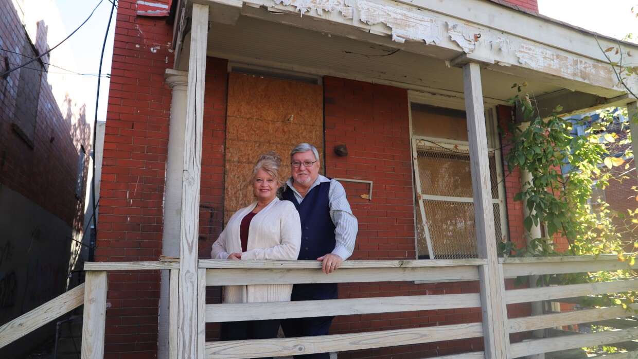 Bob Story and his wife TK in front of his former home in Camp Washington.