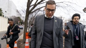 Rep. George Santos, R-N.Y., leaves a House GOP conference meeting in Washington, D.C., on Jan. 25, 2023.