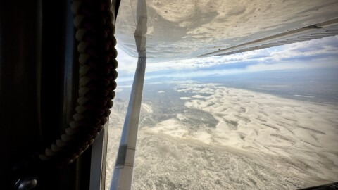 Sand dunes from a helicopter window. 