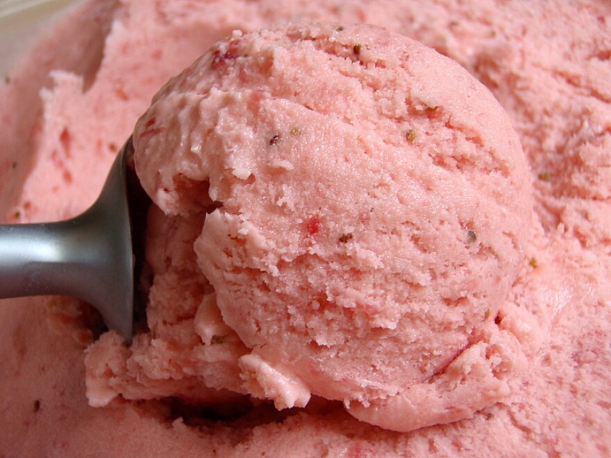 Close up of strawberry ice cream being scooped