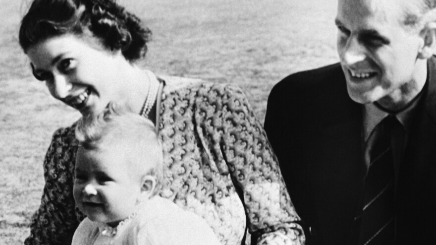 Prince Charles at 8 months old with his parents, Princess Elizabeth and the Duke of Edinburgh, on July 18, 1949, in Ascot, England.