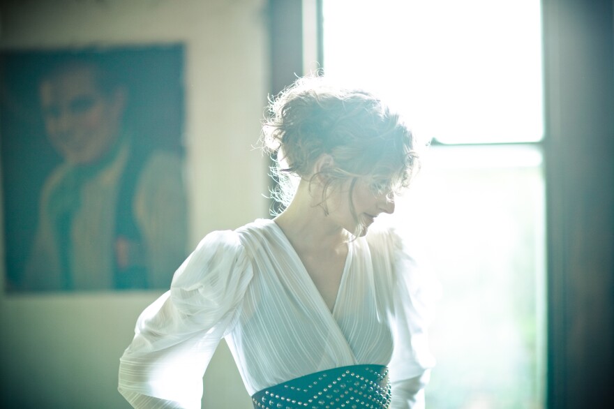 Abby in front of a window