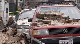 Bricks that fell from an earthquake cover parked cars in Seattle's Pioneer Square district, Wednesday, Feb. 28, 2001 after a magnitude 6.8 earthquake which damaging buildings and roads, and closing Seattle's two airports.