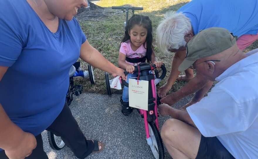 Liliana is fitted for her bike. Robbie’s Riders, Grampy’s Charities and Sanibel Captiva Community Bank presented custom-made, adaptive bicycles and tricycles to local special needs children. Eight adaptive tricycles, worth nearly $3,000 each, were given out on Friday, March 20, 2026.