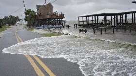 Storm surge breaks over a small sea wall near boat docks, Monday, Aug. 5, 2024, in Horseshoe Beach, Fla. Hurricane Debby made landfall early this morning. (Christopher O'Meara/Associated Press)