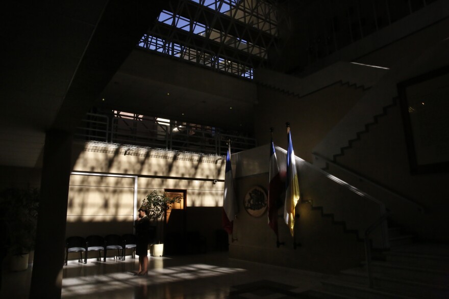 A guard inside the National Congress of Chile, in Valparaiso. In 2016, the Chilean Congress passed <em>gratuidad —</em> "free college" — by a vote of 92-2.