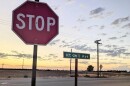 A stop sign near an empty field in Southeast Fresno.