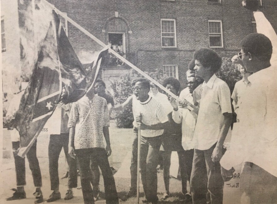 Black students burn a Confederate battle flag in protest at the University of Mississippi. In 1970, the Black Student Union demanded that Ole Miss disassociate with Confederate symbols. They said waving the flag was a reminder that Ole Miss was still a "white man's university," eight years after James Meredith had integrated the college campus most associated with the Old South.