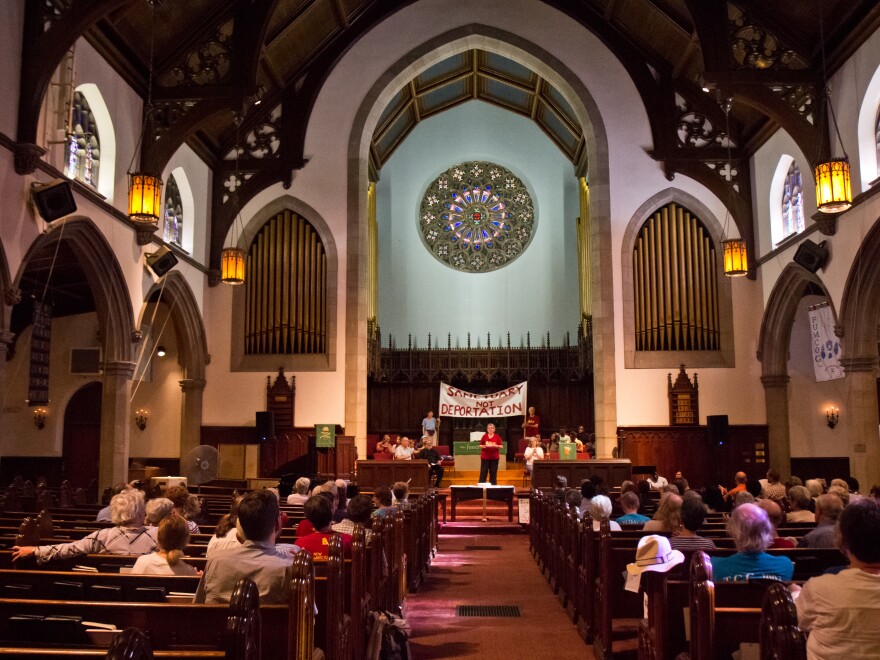 Members of the First United Methodist Church of Germantown's congregation gather to support families given sanctuary.