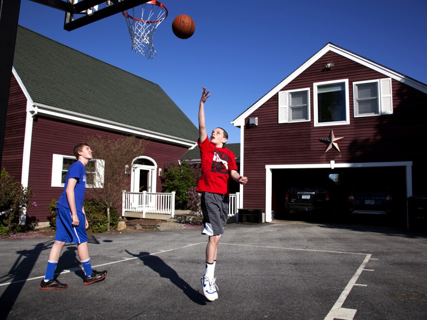 Chandler and Noah shoot hoops. Noah recently went on a school trip to Washington, D.C., without worrying or needing to call back home.