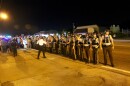 St. Louis County Police form a line in front of protesters on Tuesday. They were put in charge of securing protests on Monday when St. Louis County Executive Steve Stenger called a state of emergency.