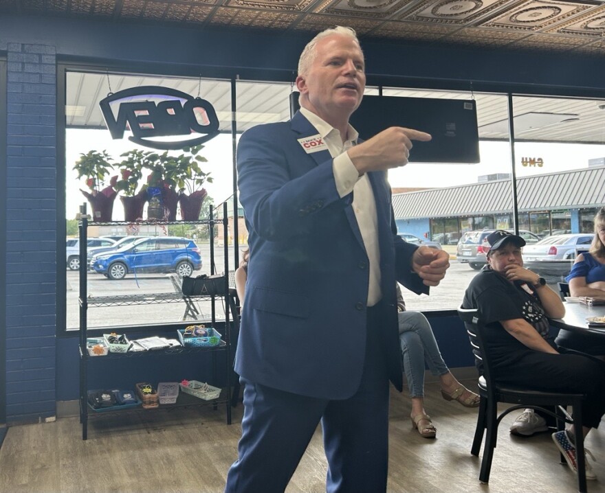 Mike Cox speaks to voters at Cops and Donuts in Mount Pleasant on Tuesday, June 24, 2026