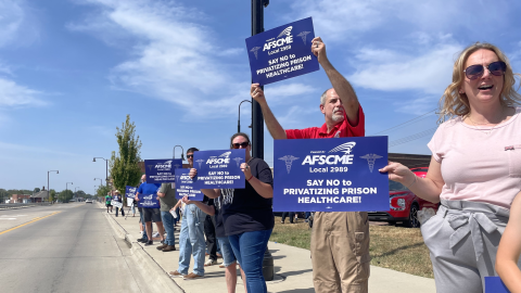 Protesters gather Sept. 17, 2025, on the riverfront in Fort Madison to oppose the potential privatization of health care at Iowa's prisons.