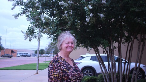 Roxzine Stinson poses for a portrait outside of the Lubbock County Elections Office.