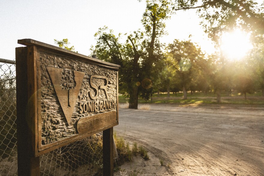 Sonic Ranch's logo is carved in a sign at the entrance to the recording studio surrounded by pecan groves on 1,700 acres along the Rio Grande near Tornillo, Texas. 