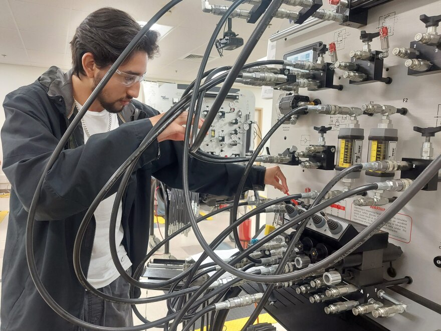 Dylan Ruiz, a 17-year-old senior at Legacy High School in Midland, works through a training scenario on preventing oil leaks during his class on pumps, compressors and mechanical drives at Midland College’s Petroleum Energy Program.