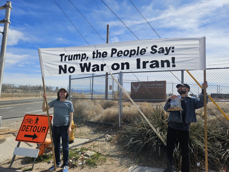 Ethan Schmerling, left, said "there's no reason why our tax dollars, why our soldiers, why any of our resources, should be going for this current strike."
