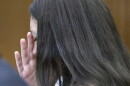 Lindsay Clancy listens to medical testimony from doctors who treated her children during her trial. Clancy, 36, does not deny she killed her three young children, but her attorney argues she should not be held criminally responsible because she was suffering from postpartum psychosis when she strangled them.