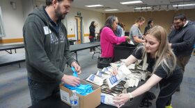 Jeff Toole and Bernadette Hartley help assemble kits containing naloxone, a drug that reverses opioid overdoses, at a Aug. 29, 2025 event in Anchorage. The volunteer event held at the Fairview Community Recreation Center was organized by the Alaska Department of Health's Project HOPE and the Alaska Native Tribal Health Consortium. Wider distribution of the naloxone kits may have contributed to a decreate in overdose deaths.