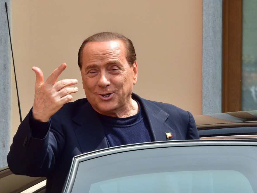 Former Italian Prime Minister Silvio Berlusconi leaves a Catholic hospice in Cesano Boscone on May 9, 2014, after serving his first day of community service for tax fraud.