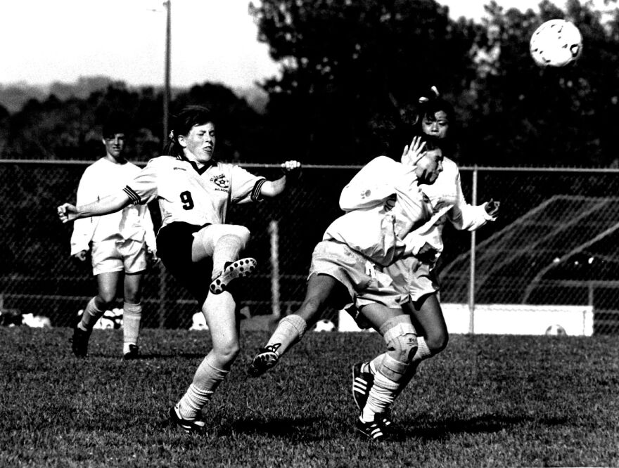Grandview's Stephany Fromson tries to protect herself from a shot off the foot of St. Teresa's Annie McShane in a Missouri sectional soccer game at Grandview in 1992.