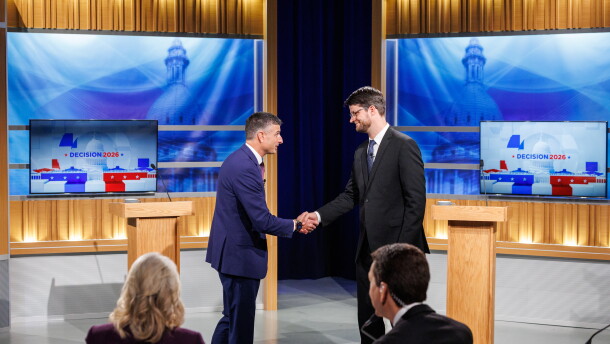 U.S. Rep. Tom Barrett, R-Charlotte, left, and Democratic nominee for U.S. House William Lawrence, right, shake hands at their first head-to-head debate at WKAR's studios in East Lansing, Mich., on Oct. 6, 2026.