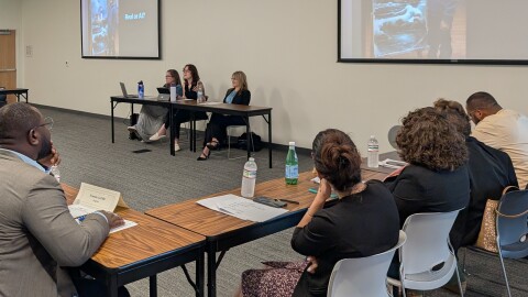 At the Mid-Continent Public Library a class of international visitors take part in a workshop that discusses media altered with artificial intelligence.