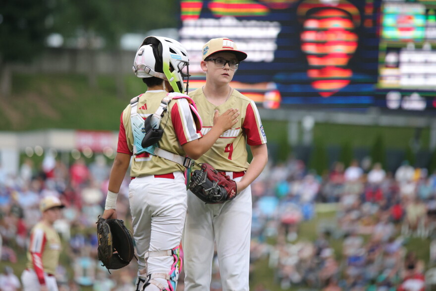 Henderson, Nev.'s Owen Guzman, left, meets with Payton Hinsen, right, during the third inning of the Little League World Series Championship baseball game against Curacao, Sunday, Aug. 30, 2026, in South Williamsport, Pa. (AP Photo/Jared Freed)