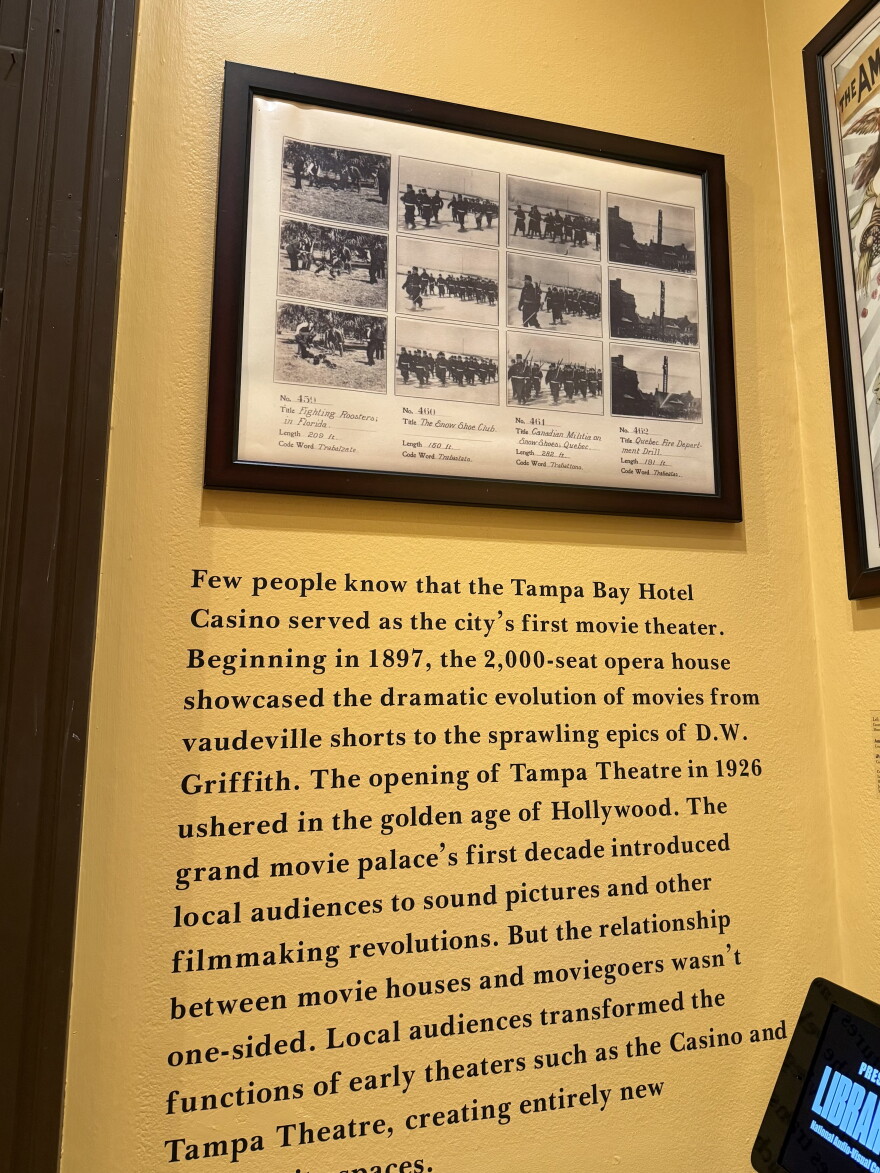A framed photo of 12 still shots representssent early film captured in Tampa. 