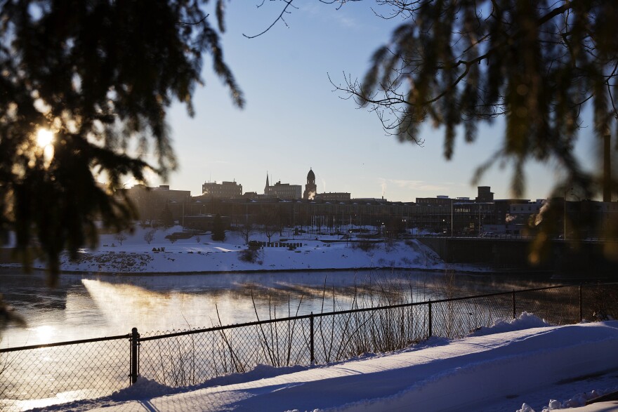 The sun rises over Downtown Lewiston, Maine, Friday, March 17, 2017.