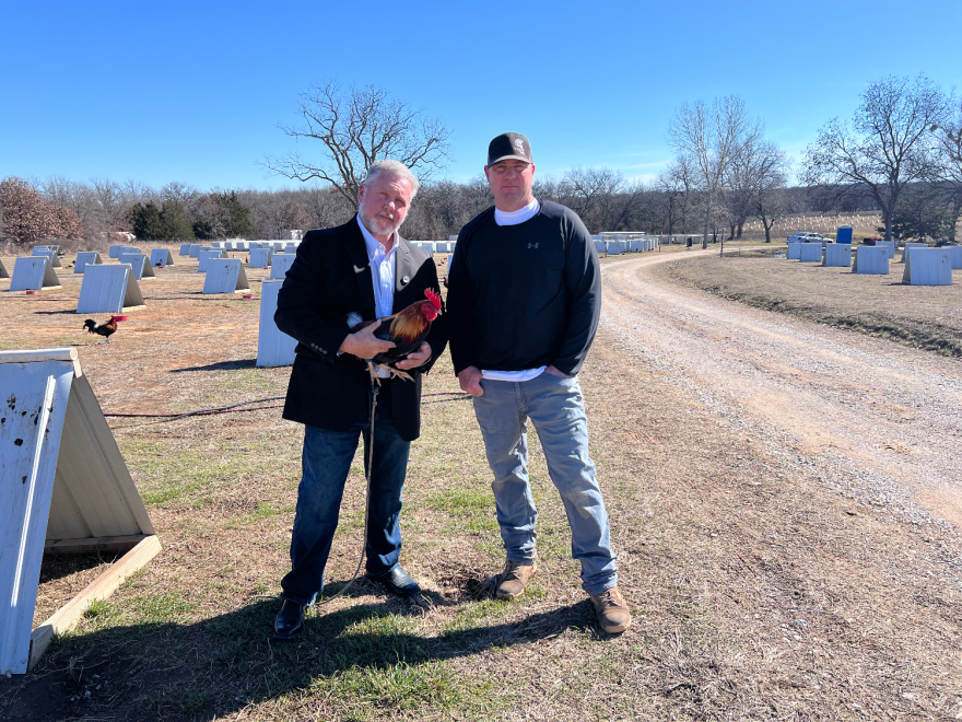 President of the Oklahoma Gamefowl Commission, Anthony DeVore (left), and Troy Thompson pose for a picture on Thompson's farm.