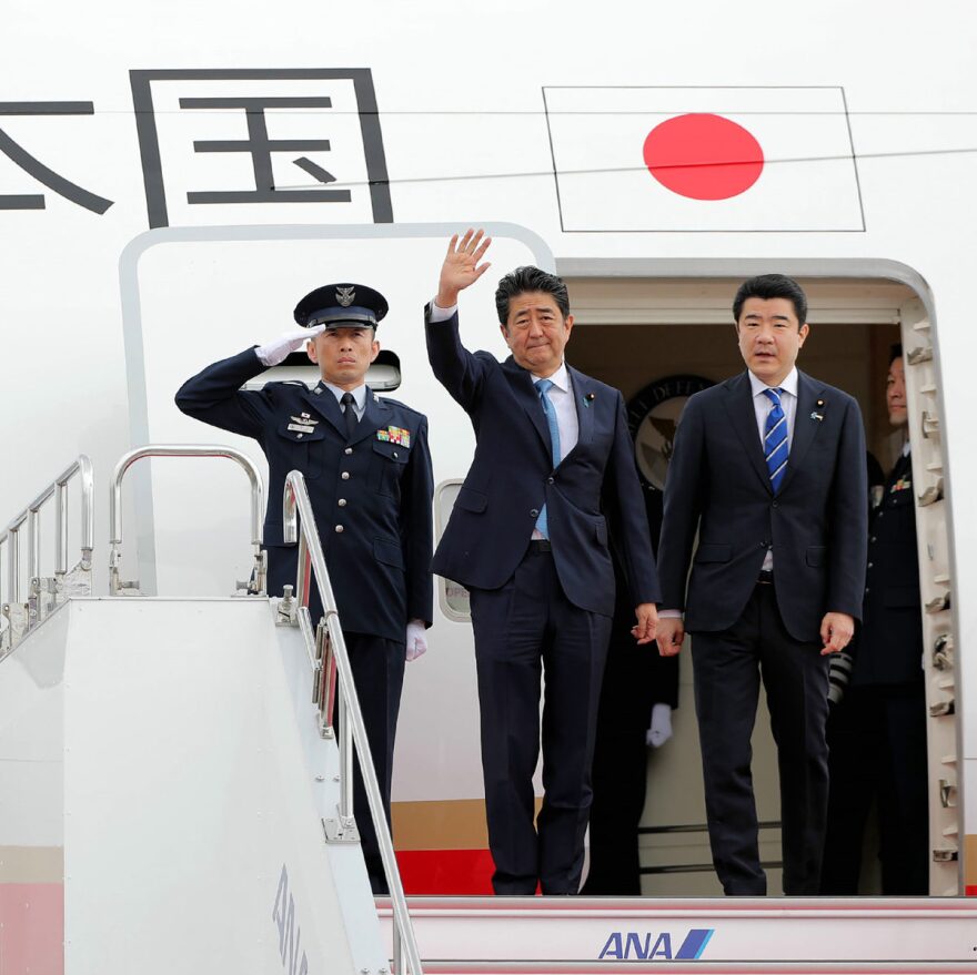 Japan's Prime Minister Shinzo Abe waves to well-wishers on his departure from Tokyo's Haneda Airport on Wednesday for a two-day visit to Ira