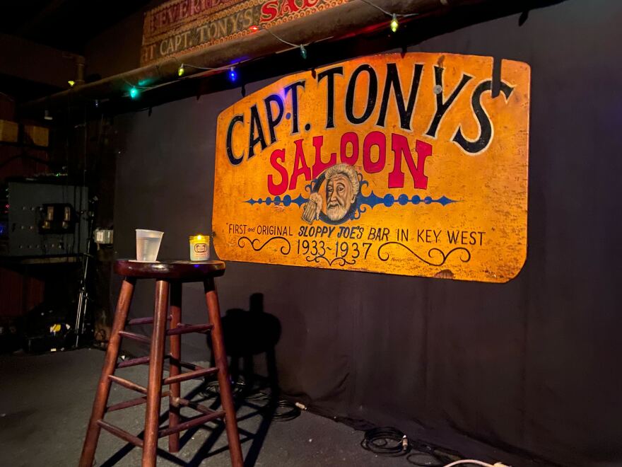 Captain Tony’s Saloon in Key West paid their respects to Mike Leach, Mississippi State University’s head football coach, who died Dec. 12 at 61. Leach called Key West his favorite spot. He was so beloved on the island that this famous watering hole honored him with own barstool. No one was sitting in it on Dec. 13, 2022. Bar staff placed it on an empty stage with a candle and a drink as a vigil.