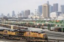 FILE - Los Angeles skyline is seen above the Union Pacific LATC Intermodal Terminal is seen on Tuesday, April 25, 2023 in Los Angeles.