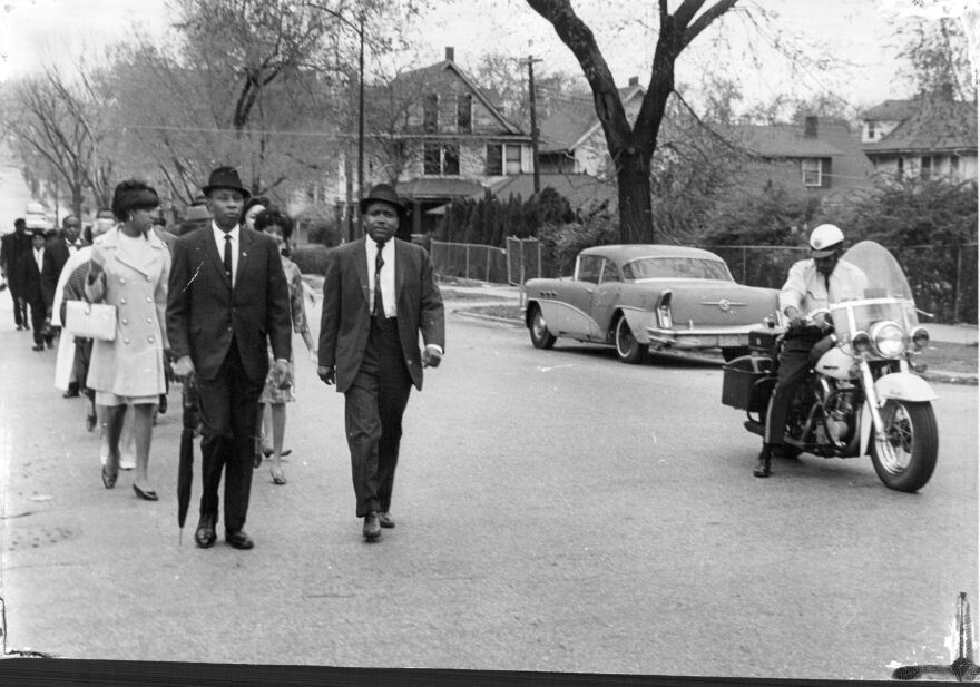 64 people took part in a march outside the Kansas City, Kansas, City Hall in April 1967 to protest the shooting of a 70-year-old Black woman by police. Robert Hughes (left) is the president of the Kansas City, Kansas, chapter of the National Association for the Advancement of Colored People. Next to him is Carl Randolph, president of that city's chapter of the Congress of Racial Equality.