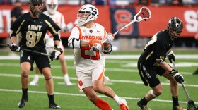 Tucker Dordevic (white, 23) in Syracuse’s 2021 season opening loss against Army.