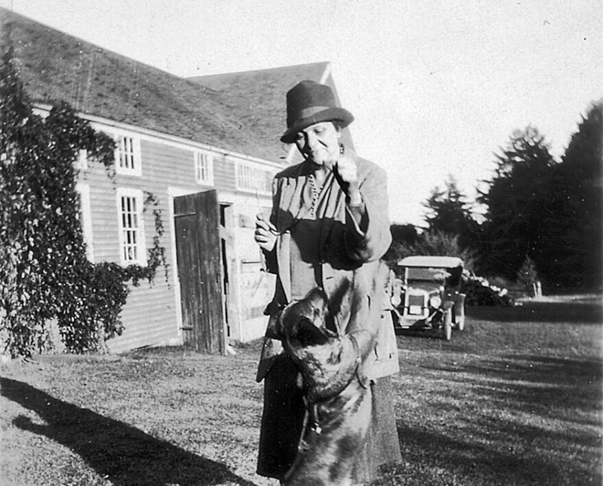Frances Perkins with her dog on the homestead.