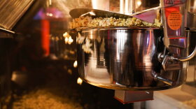 Popcorn is prepared at a Regal move theater in Irvine, Calif., Tuesday, Sept. 8, 2020. Gov. Gavin Newsom relaxed coronavirus restrictions in five more counties on Tuesday, clearing the way for restaurants, movie theaters, gyms and churches to resume indoor activities with fewer people and other modifications. (AP Photo/Jae C. Hong)