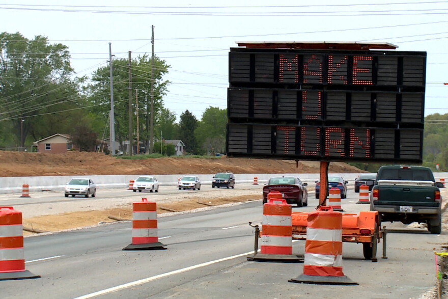 A sign along State Road 37 north instructs drivers to make a U-turn in order to access Thompson Furniture.